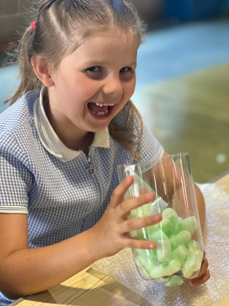 Water Rokit Activity Day - girl with payload section of rocket